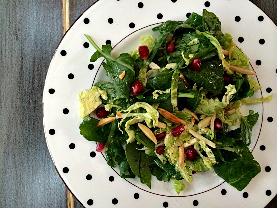 salad with kale brussel sprouts Pomegranate seeds