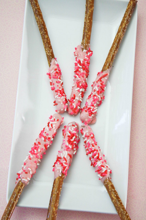 Chocolate dipped pretzels are such a fun Valentine's Day treat. There are so many ways to decorate and the end result is a decadent sweet and salty snack that everyone loves - especially the kiddos.