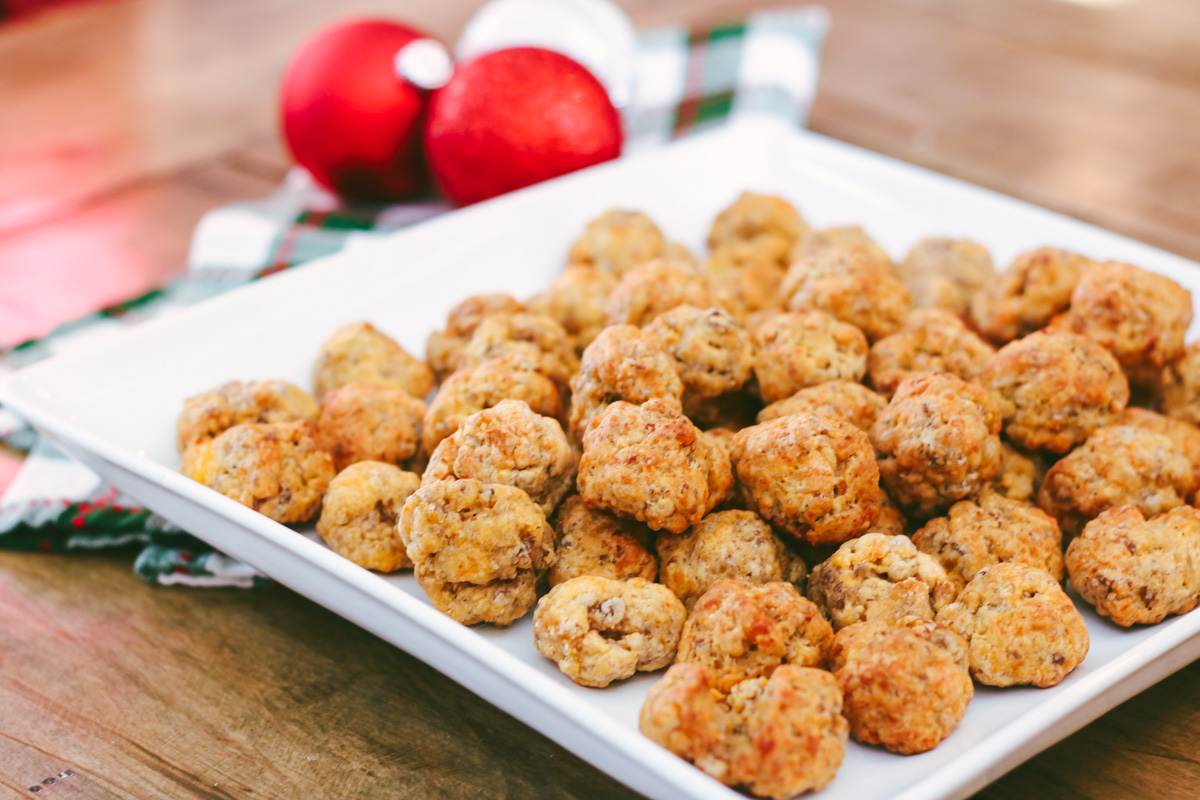 My sausage balls recipe made with Bisquick, pork sausage and cheddar is a favorite holiday appetizer and a big hit with guests. They continue to be one of my most-requested holiday recipes! Serve sausage balls at your next holiday party.